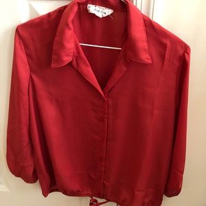 Red button up blouse.